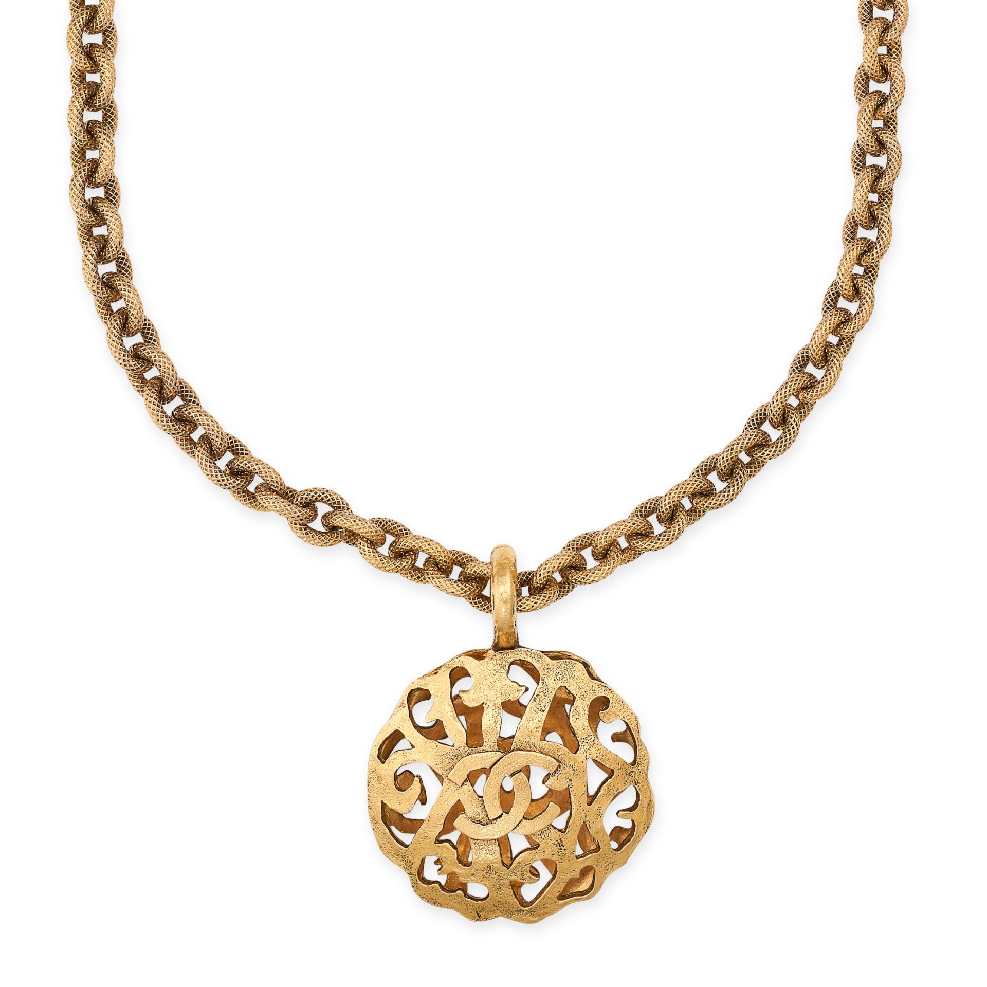 NO RESERVE - CHANEL, A VINTAGE PENDANT AND CHAIN comprising an openwork pendant with interlocking...