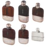 A COLLECTION OF SIX ANTIQUE HIP FLASKS, five with leather cases, three Victorian, two George V, o...