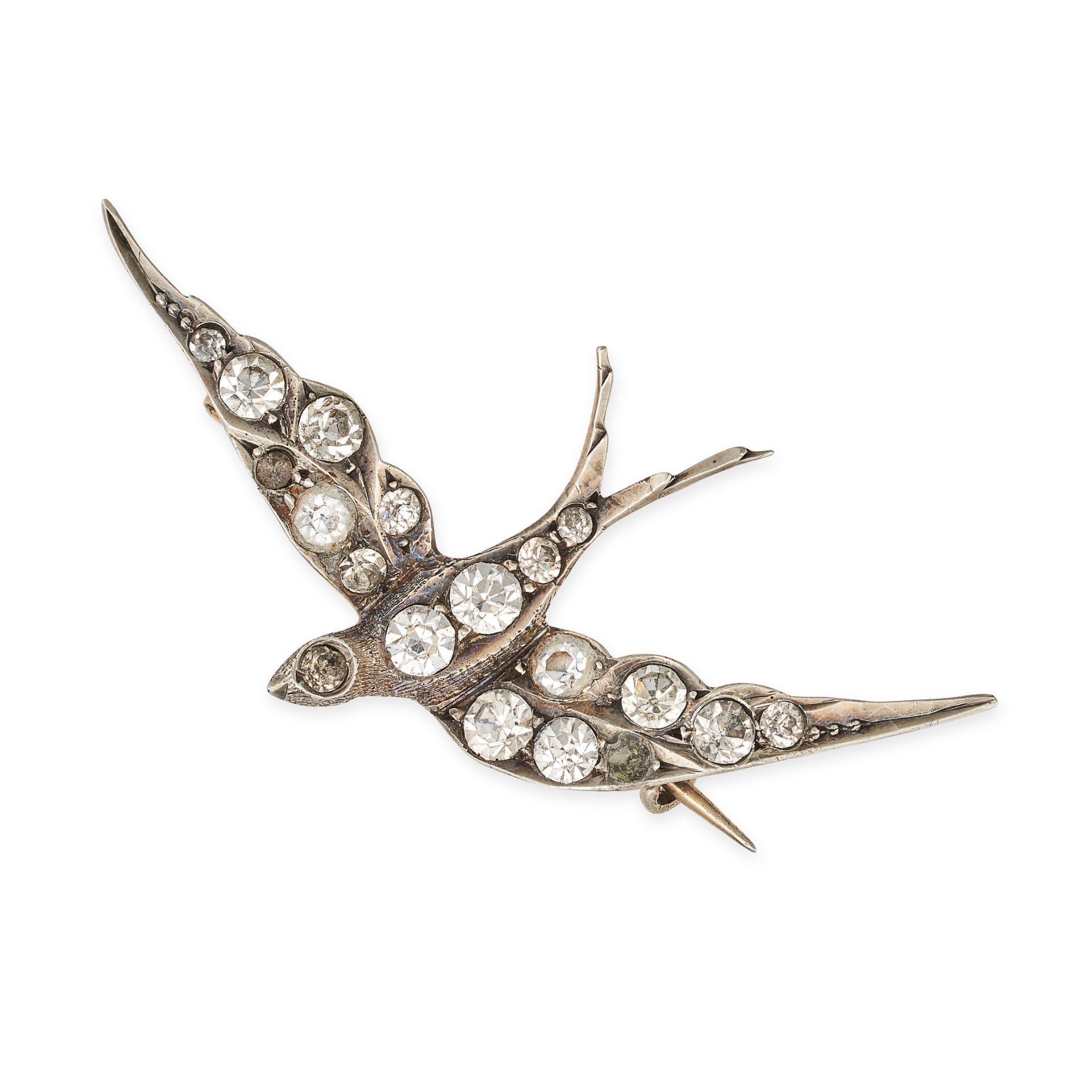 NO RESERVE - A WHITE GEMSTONE SWALLOW BROOCH designed as a swallow in flight, set throughout with...