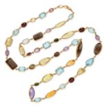 A LONG GEMSET SAUTOIR NECKLACE in yellow gold, set with amethyst, citrine, smokey quartz, blue to...