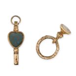 TWO ANTIQUE PENDANTS / CHARMS one designed as a key, set to each side with a heart shaped orange ...