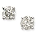 A PAIR OF SOLITAIRE DIAMOND STUD EARRINGS in 18ct white gold, each set with a round brilliant cut...