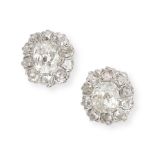 A PAIR OF DIAMOND CLUSTER EARRINGS each set with an old cut diamond in a cluster of further old c...