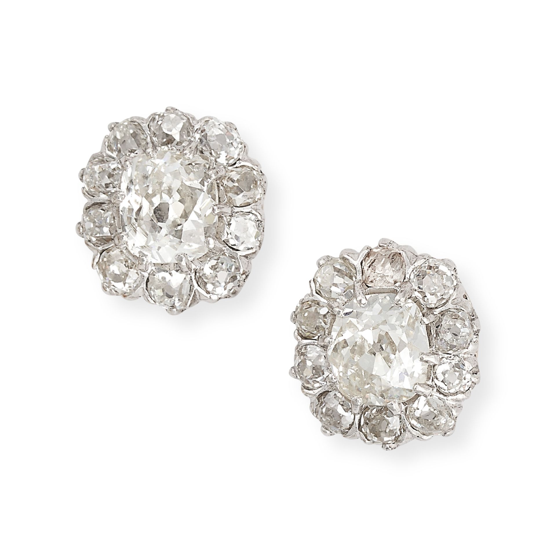 A PAIR OF DIAMOND CLUSTER EARRINGS each set with an old cut diamond in a cluster of further old c...