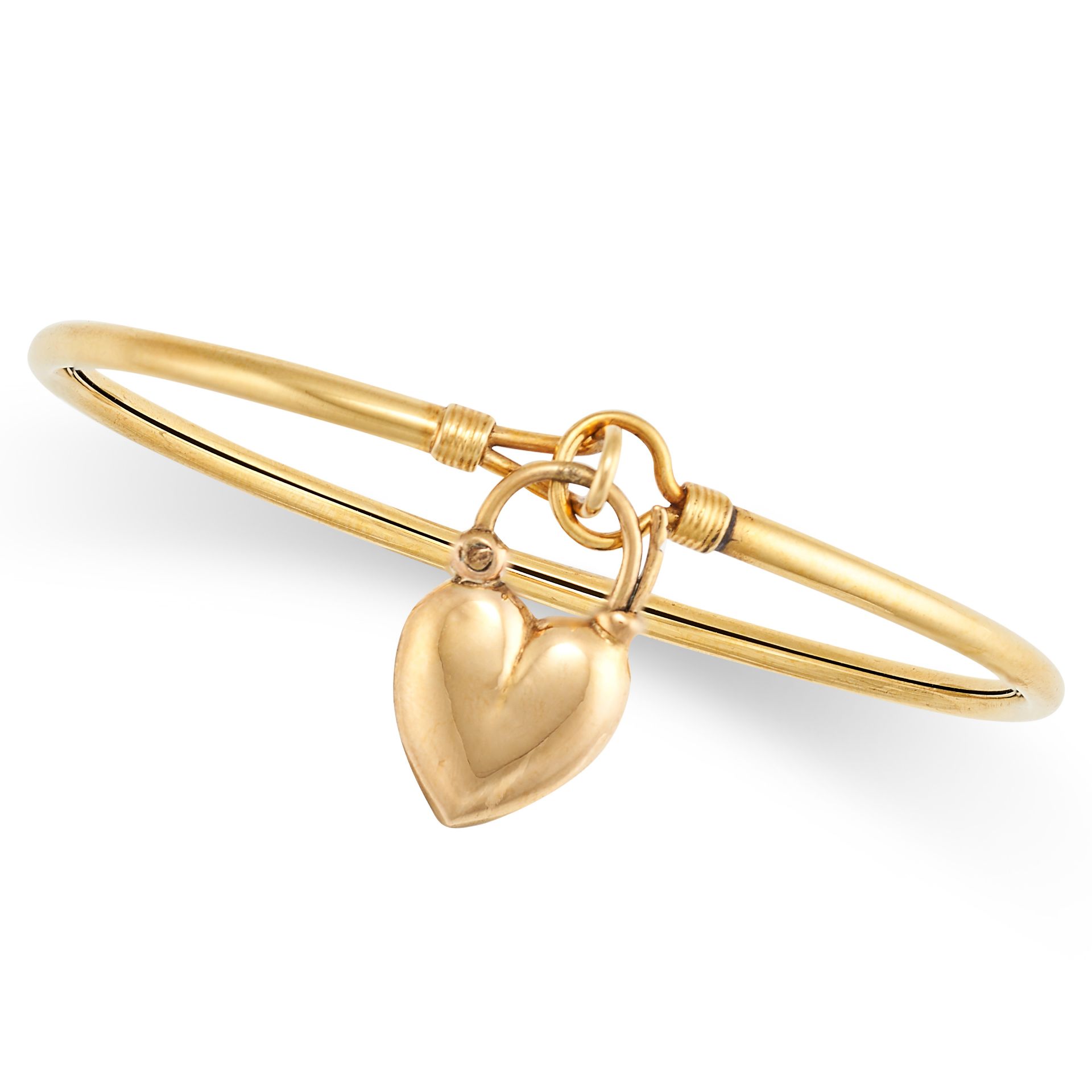 A GOLD BANGLE in yellow gold, suspending a heart shaped padlock charm pendant, no assay marks, in...