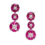 A PAIR OF RUBY AND DIAMOND DROP EARRINGS in 18ct white gold, each set with three clusters of bril...
