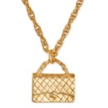 CHANEL, A VINTAGE HANDBAG PENDANT NECKLACE comprising a Chanel quilted handbag pendant, to a fanc...