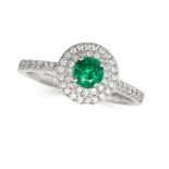 AN EMERALD AND DIAMOND CLUSTER RING in platinum, set with a round cut emerald of 0.40 carats in a...