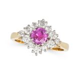 A RUBY AND DIAMOND CLUSTER RING in 18ct yellow gold, set with a round cut ruby of 0.95 carats in ...