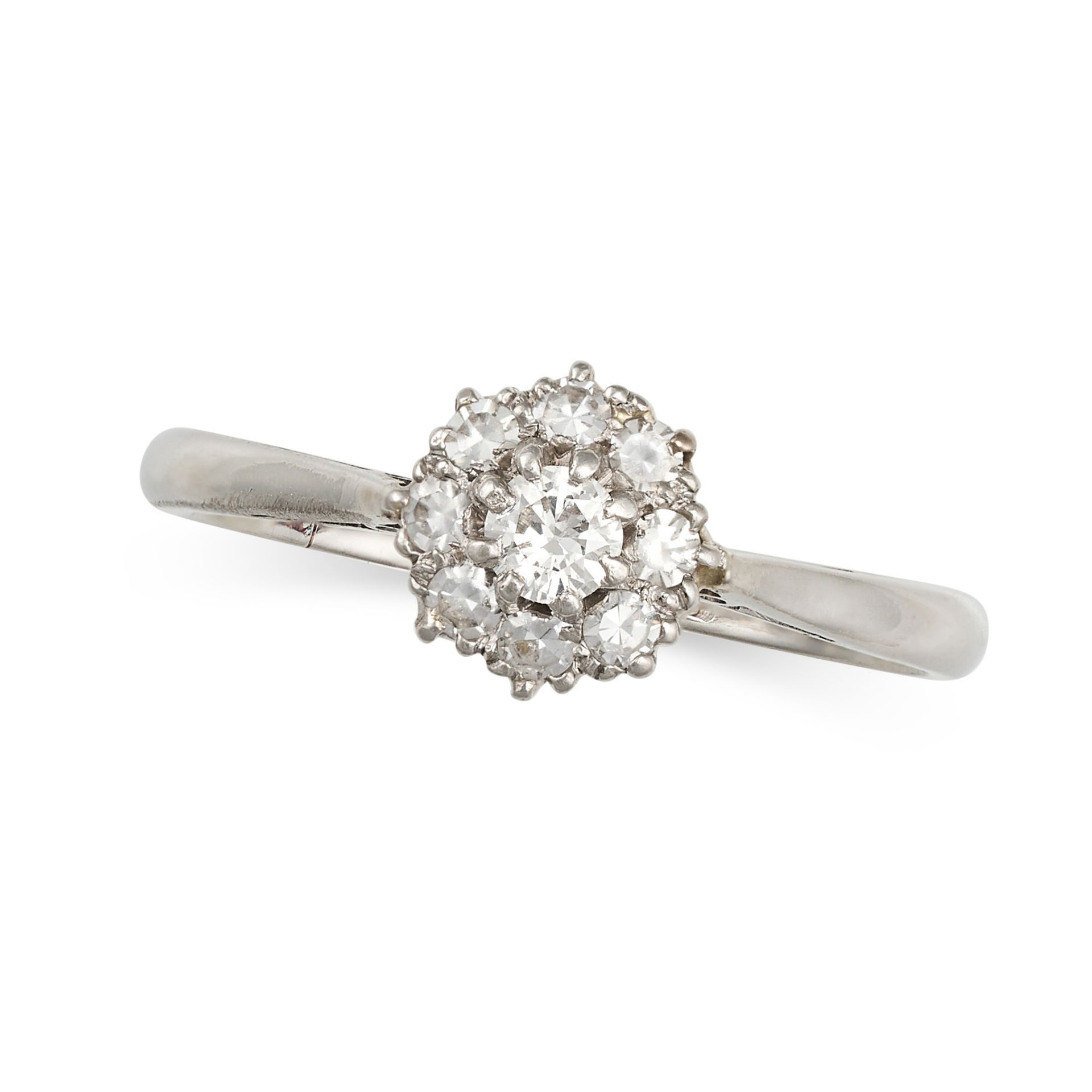 A DIAMOND CLUSTER RING set with a round brilliant cut diamond in a cluster of single cut diamonds...