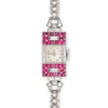 AN ART DECO RUBY AND DIAMOND COCKTAIL WATCH, 1930S in platinum, the square silvered dial with dot...