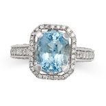 AN AQUAMARINE AND DIAMOND DRESS RING in 18ct white gold, set with an oval cut aquamarine to a sur...
