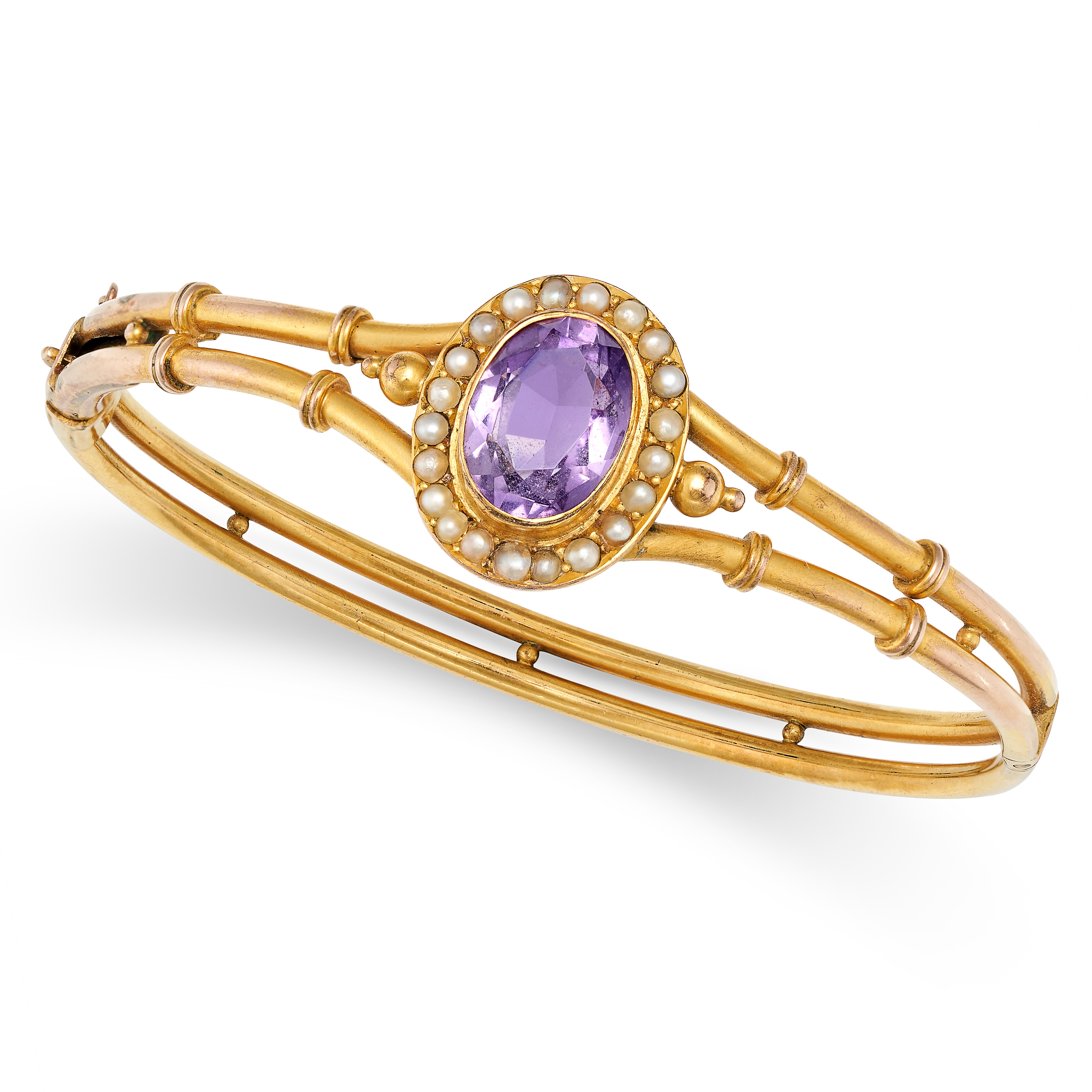 AN ANTIQUE VICTORIAN AMETHYST AND PEARL BANGLE in 9ct yellow gold, set to the centre with an oval...