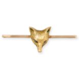 AN ANTIQUE DIAMOND FOX BAR BROOCH in 9ct yellow gold, stylised as a fox's head, the eyes set with...
