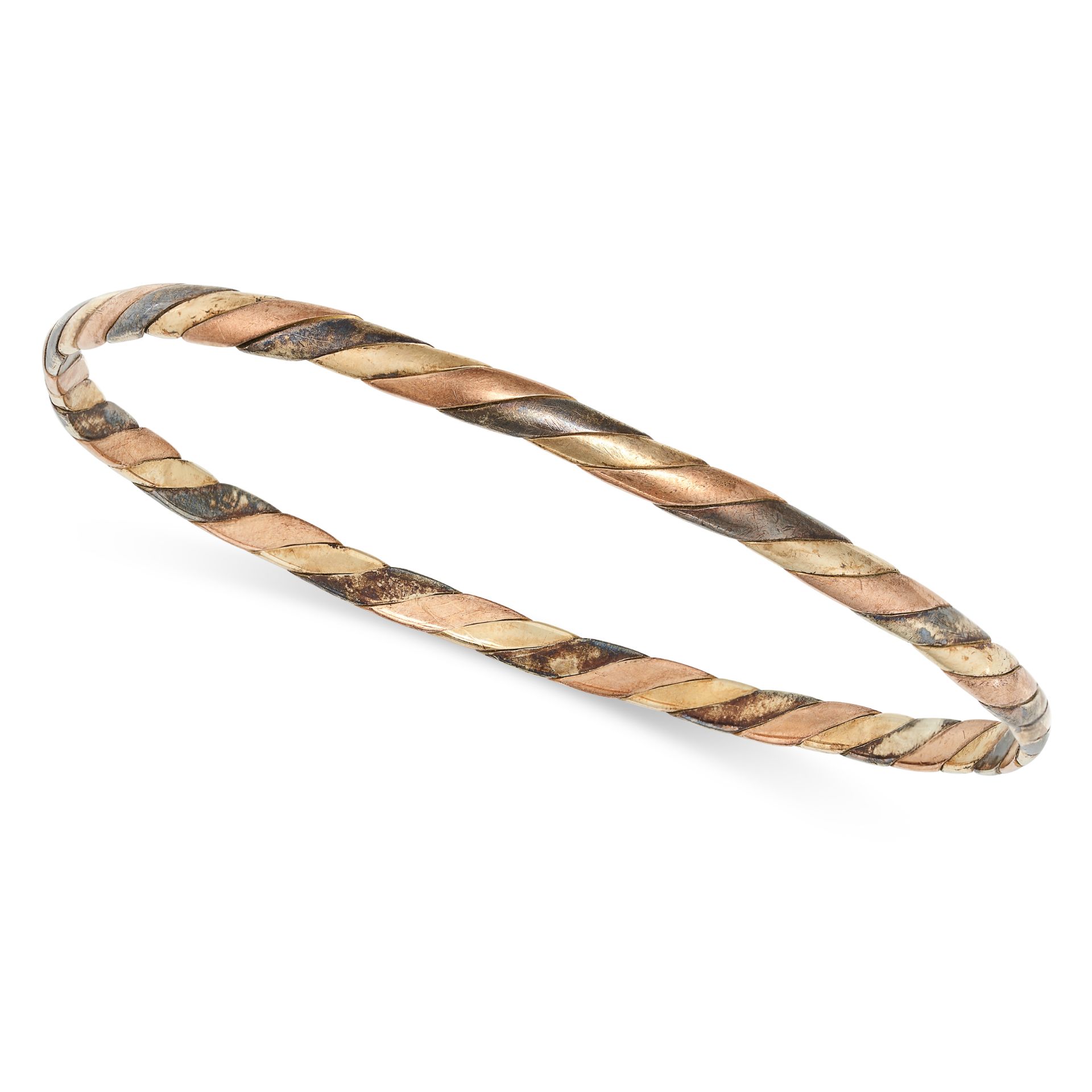 A VINTAGE TRICOLOUR GOLD BANGLE in 9ct yellow, rose and white gold, in a twisted design, full Bri...