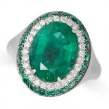 AN EMERALD AND DIAMOND CLUSTER RING in 18ct black rhodium plated gold, set with an oval cut emera...