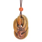 A CARVED HARDSTONE AND CORAL SNAKE NECKLACE the hardstone carved to depict a coiled snake surmoun...