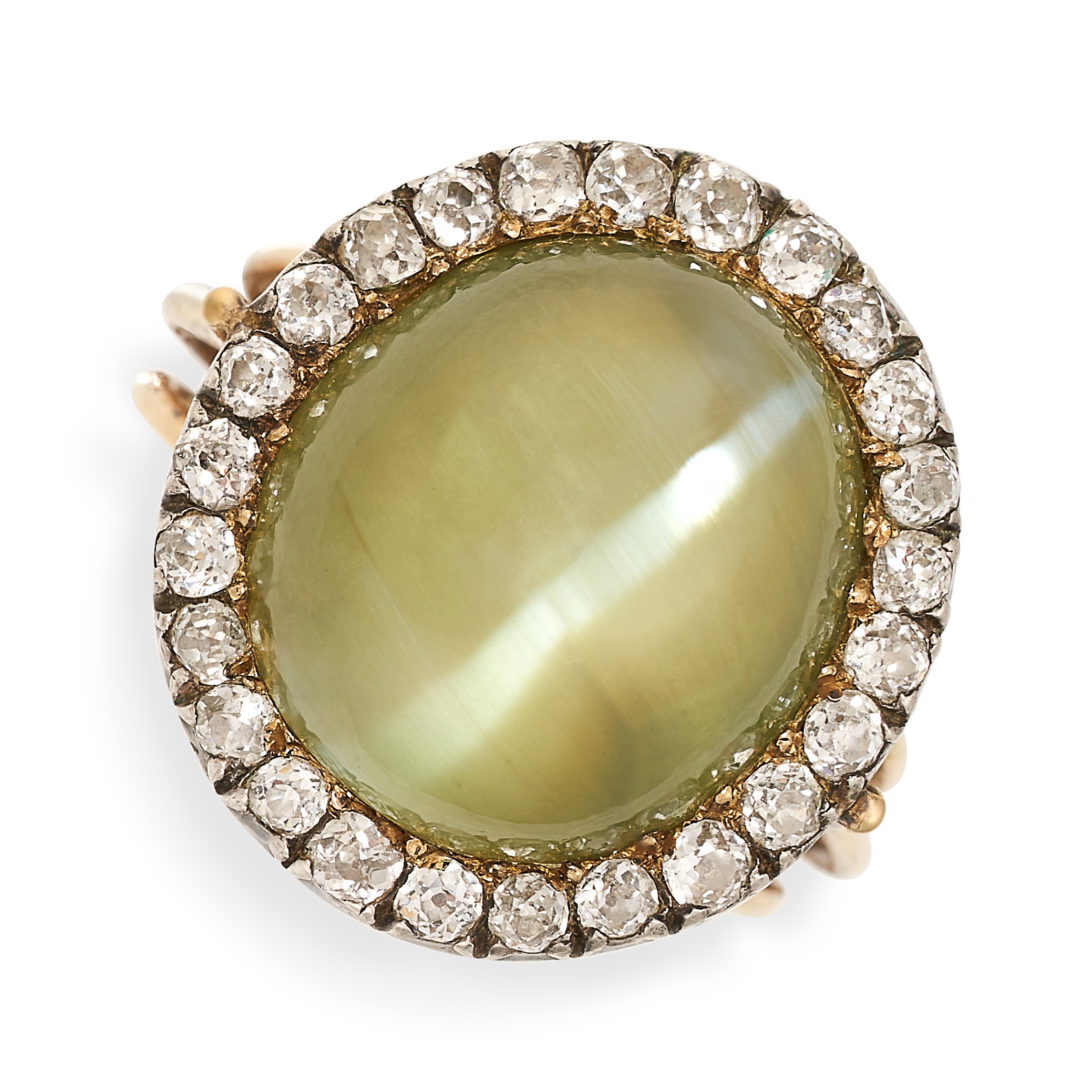 AN EXCEPTIONAL CAT'S EYE CHRYSOBERYL AND DIAMOND RING in yellow gold and silver, set with a large...