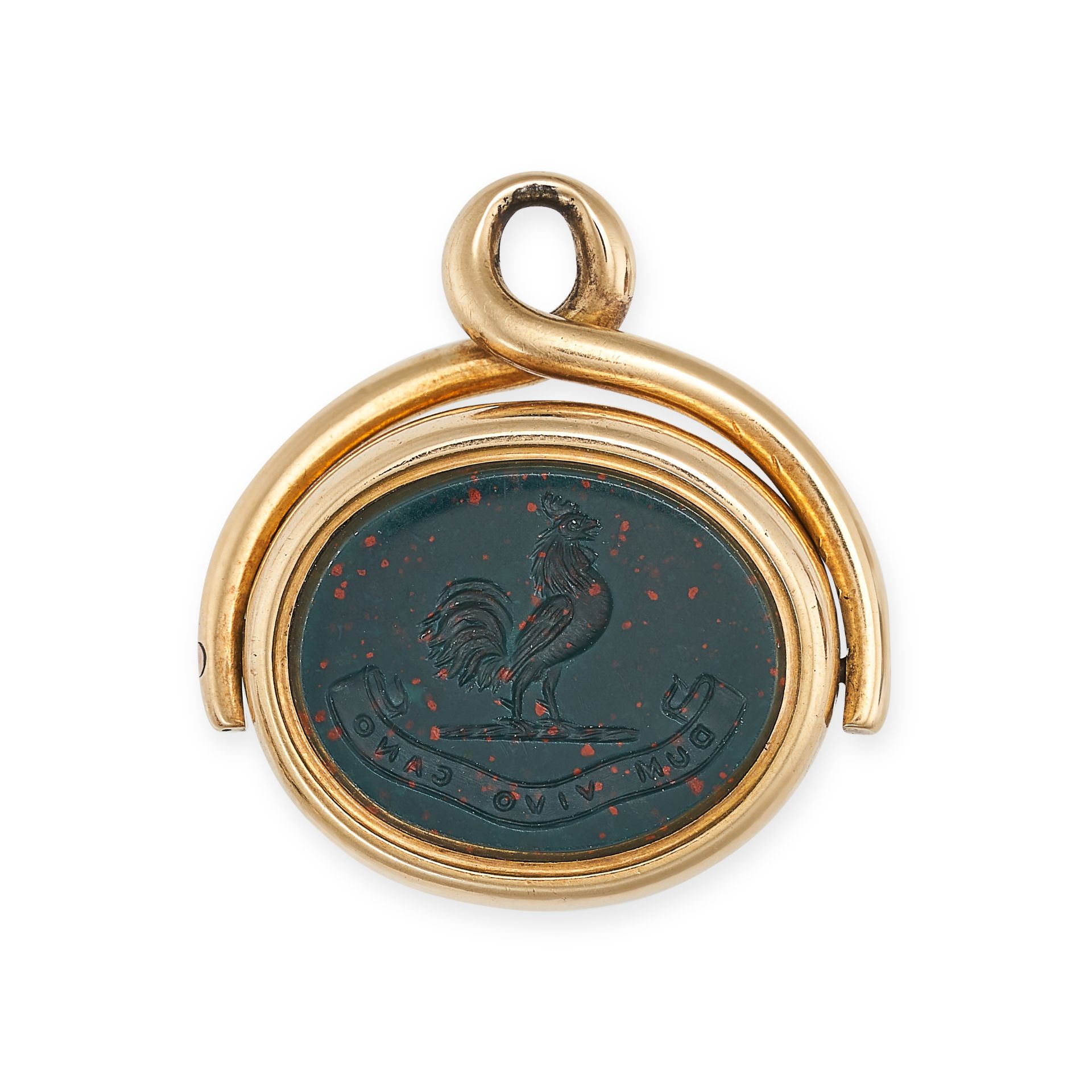 AN ANTIQUE HARDSTONE FOB SEAL / PENDANT in yellow gold, the swiveling oval fob set on a scrolling...