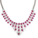 A RUBY AND DIAMOND FRINGE NECKLACE in white gold, comprising a row of octagonal step cut rubies i...