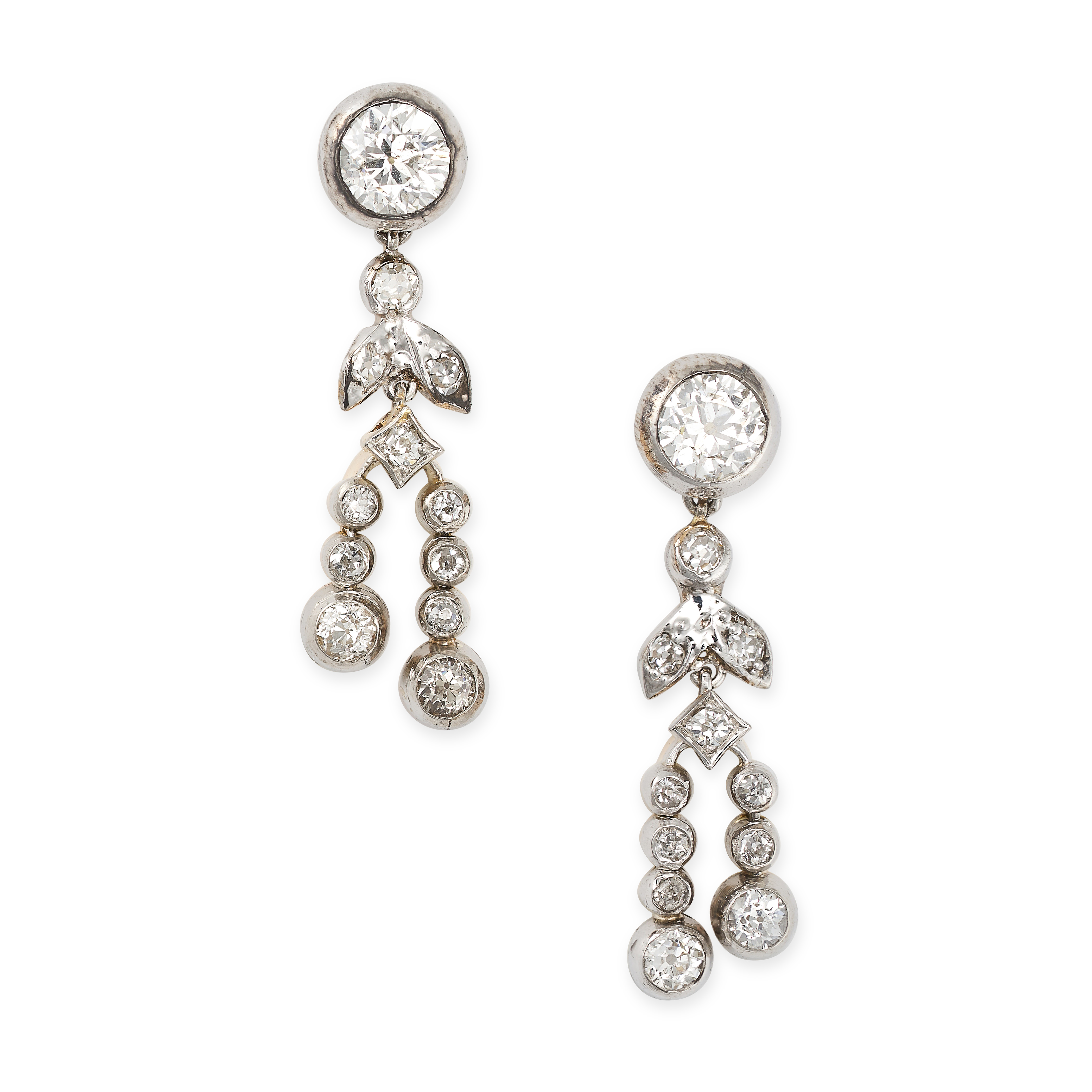 A PAIR OF DIAMOND DROP EARRINGS in yellow gold and silver, each set with an old European cut dia...