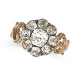 AN ANTIQUE PASTE CLUSTER RING in yellow gold, set with a cluster of old cut paste to stylised scr...