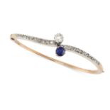 AN ANTIQUE SAPPHIRE AND DIAMOND BANGLE in yellow gold, the hinged body set with a round cut sapph...