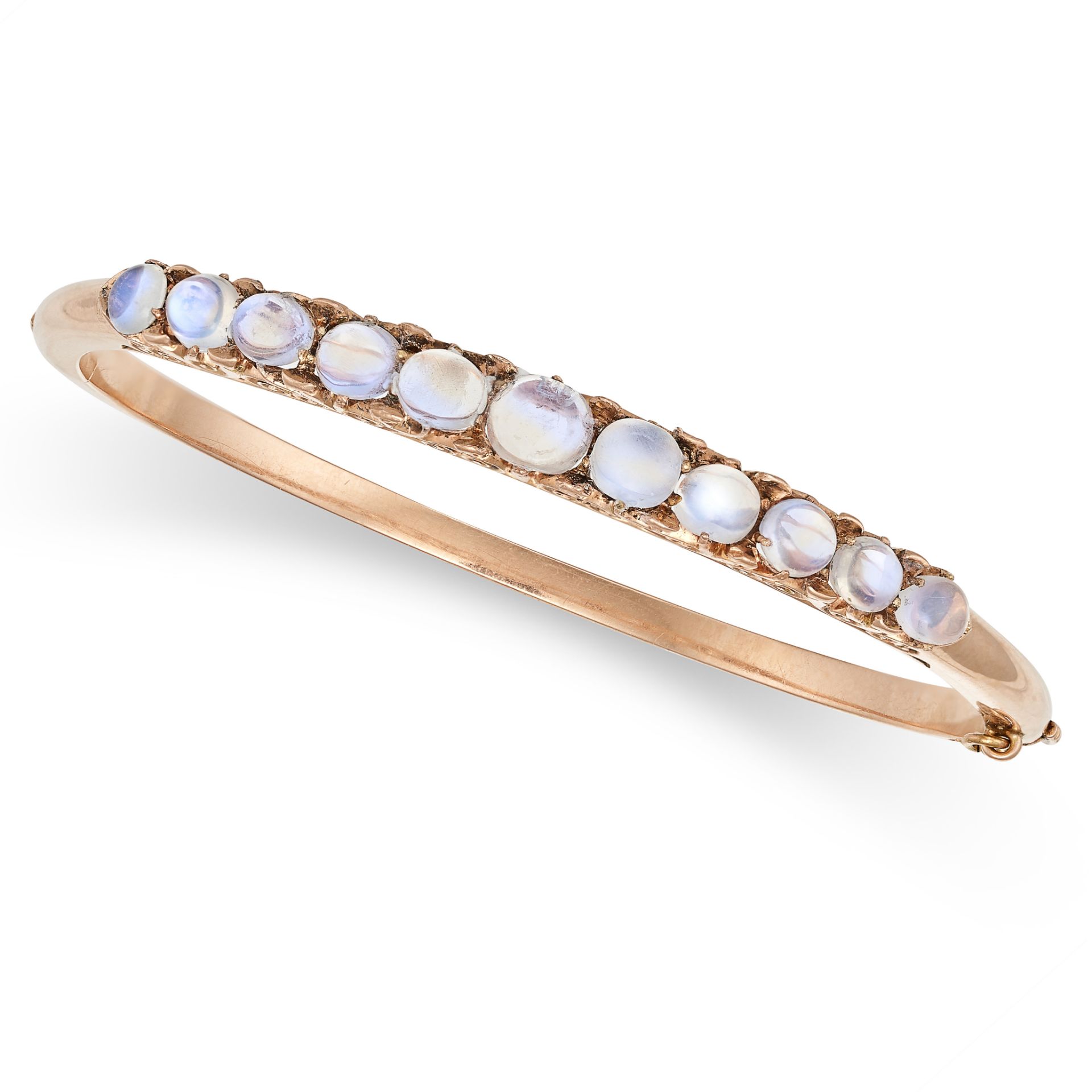 AN ANTIQUE MOONSTONE BANGLE in yellow gold, the hinged body set with a row of cabochon moonstones...