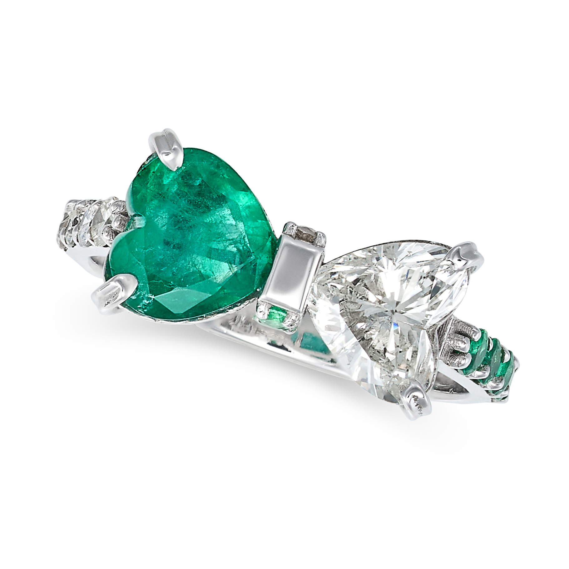 AN EMERALD AND DIAMOND BOW RING in 18ct white gold, in bow design, set with a heart cut diamond o...