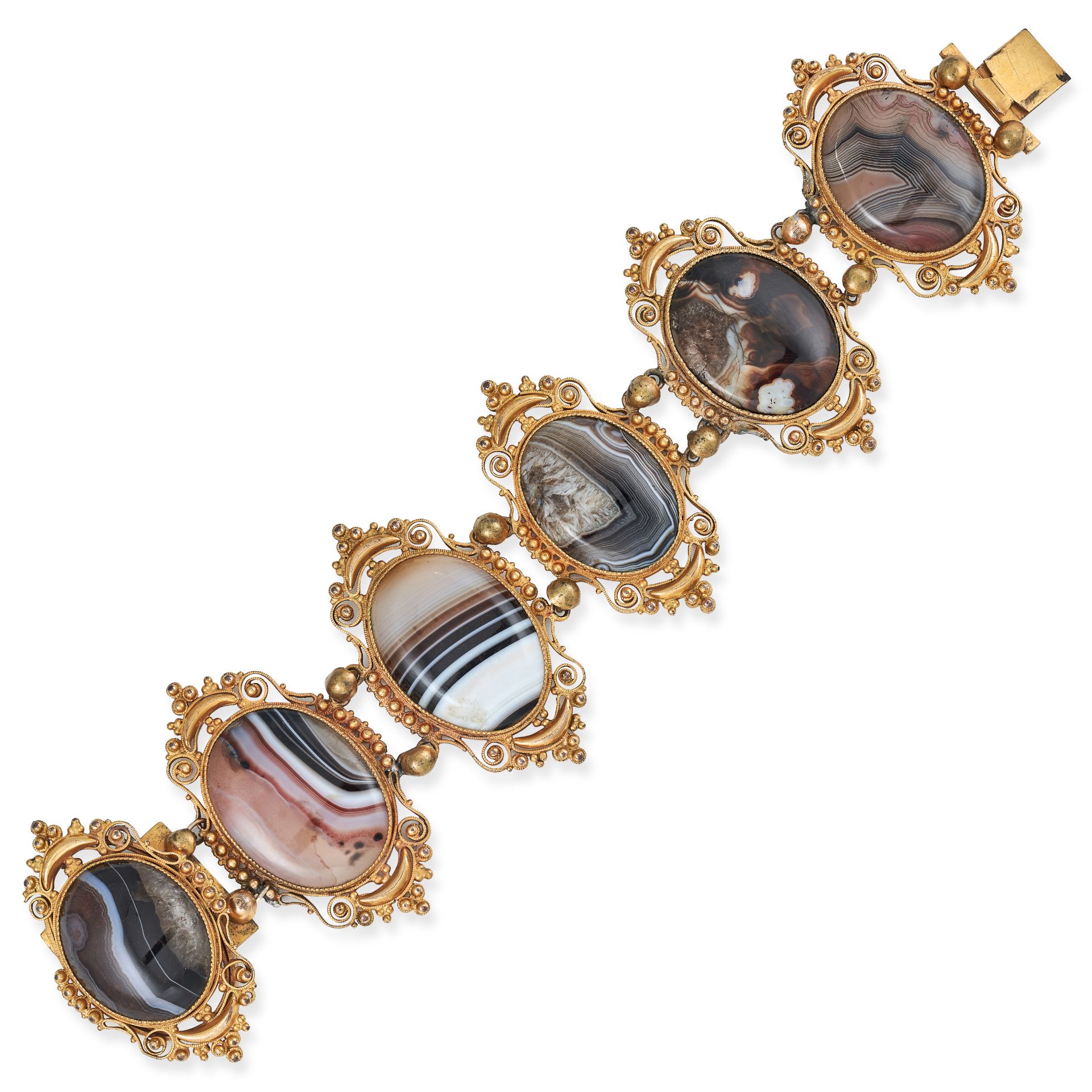 AN ANTIQUE AGATE BRACELET set with three oval polished agate in scrolling borders accented by bea...