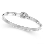 LOUIS VUITTON, A DIAMOND BANGLE in 18ct white gold, the bangle accented with a single diamond and...