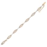 AN ANTIQUE SEED PEARL AND DIAMOND BRACELET, EARLY 20TH CENTURY in yellow gold and platinum, the n...