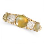 A VINTAGE CAT'S EYE CHRYSOBERYL AND DIAMOND RING in 18ct yellow gold, set with alternating caboc...