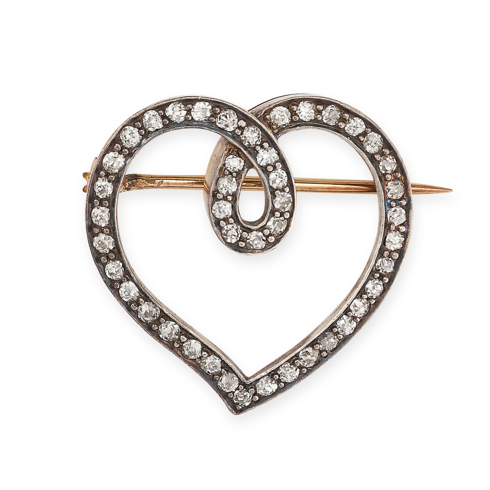 AN ANTIQUE DIAMOND HEART BROOCH, CIRCA 1900 in yellow gold and silver, designed as a heart, set w...