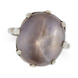 A STAR SAPPHIRE RING in 18ct white gold, set with a cabochon star sapphire of 20.85 carats, stamp...