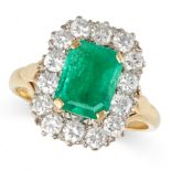 A COLOMBIAN EMERALD AND DIAMOND CLUSTER RING in 18ct yellow gold, set with an octagonal step cut ...
