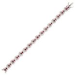 A RUBY AND DIAMOND BRACELET in 18ct white gold, comprising a row of sixteen links set with rectan...