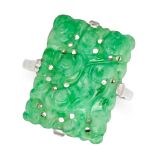 A CHINESE CARVED JADEITE JADE RING set with a rectangular piece of jadeite jade carved in the Chi...