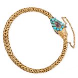 AN ANTIQUE TURQUOISE AND GARNET SNAKE BRACELET in yellow gold, designed as a snake, the head set ...