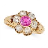 AN ANTIQUE RUBY AND DIAMOND CLUSTER RING in yellow gold, set with a round cut ruby in a cluster o...