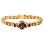 AN ANTIQUE GARNET MOURNING BRACELET in yellow gold, set with a cluster of cabochon garnets accent...