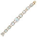 A FRENCH VINTAGE AQUAMARINE BRACELET in 18ct yellow gold, set with a row of nine graduated octago...