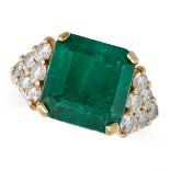 A VINTAGE EMERALD AND DIAMOND RING in yellow gold, set with an octagonal step cut emerald of appr...