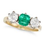 A COLOMBIAN EMERALD AND DIAMOND THREE STONE RING in 14ct yellow gold, set with an octagonal step ...