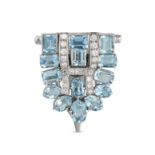 A VINTAGE AQUAMARINE AND DIAMOND CLIP BROOCH in 9ct white gold, the shield shaped brooch set with...