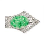 AN ANTIQUE ART DECO JADEITE JADE AND DIAMOND BROOCH designed as a shield, set with a piece of jad...