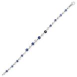 A VINTAGE SAPPHIRE AND DIAMOND BRACELET comprising a row of alternating round cut sapphires and o...