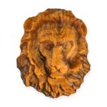 AN UNMOUNTED TIGER'S EYE LION carved to depict a lion, 2.7cm, 7.5g.