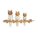 A VINTAGE PEARL AND RUBY OWL BROOCH in yellow gold, designed as three owls resting on a branch, t...