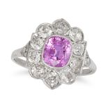 A PINK SAPPHIRE AND DIAMOND CLUSTER RING set with a cushion cut pink sapphire of approximately 1....